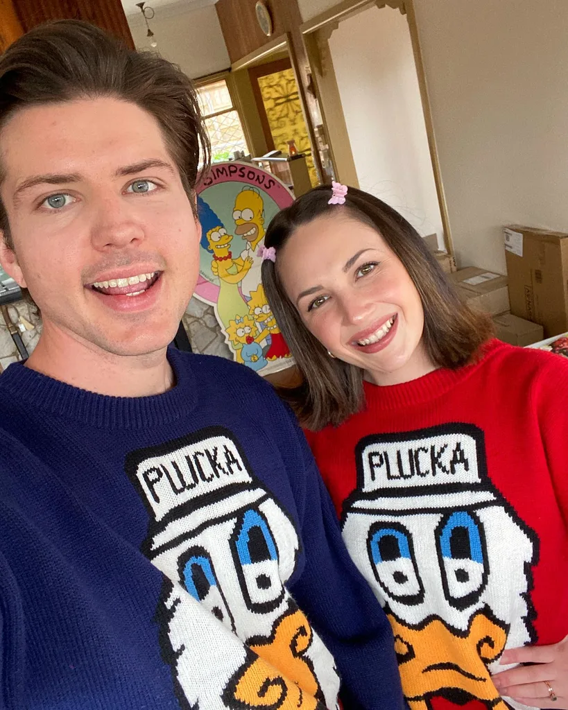 Image of man and woman wearing matching tops from the thrift store