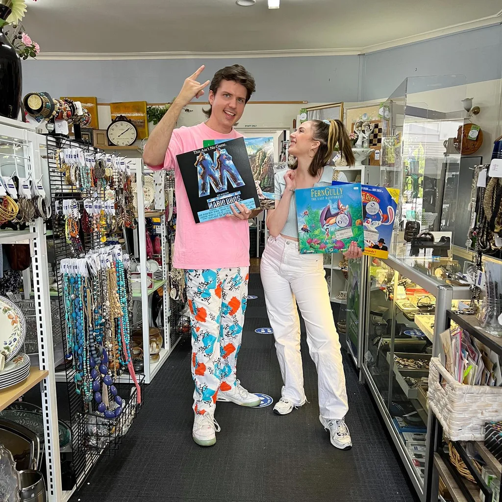 Image of man and woman standing in a thrift store