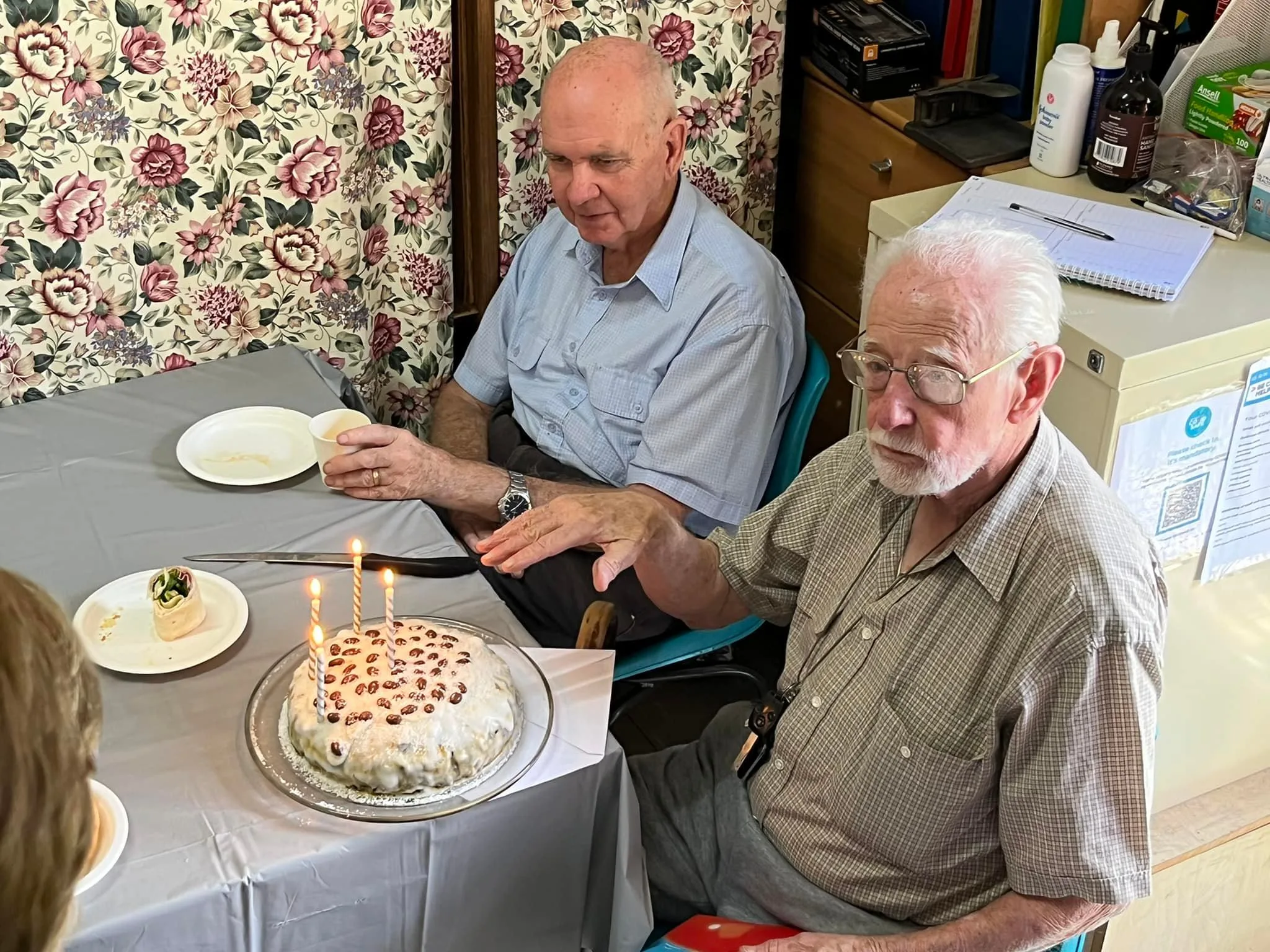 Image of man with birthday cake on his 102nd birthday