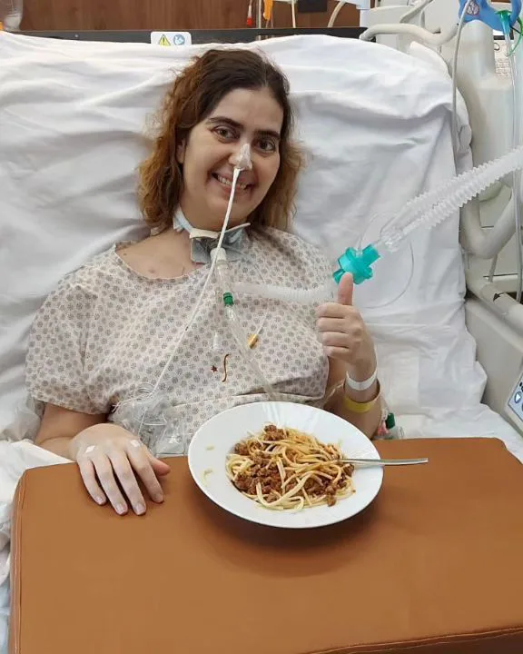 Image of woman recovering in hospital after being paralysed