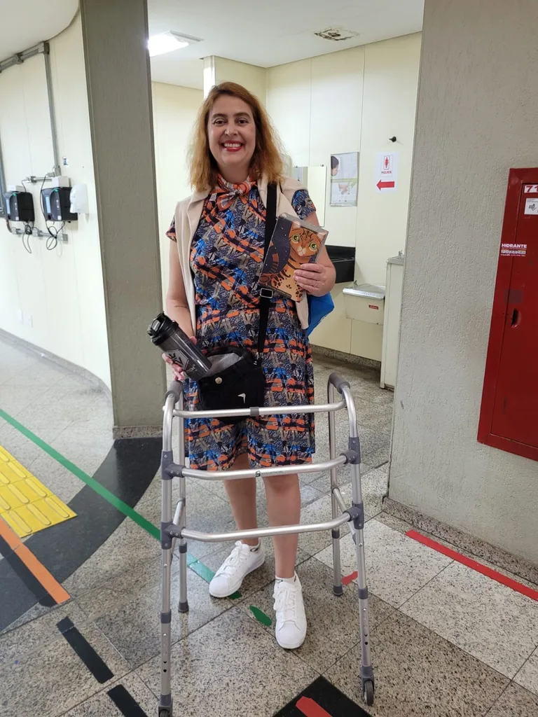 Image of woman with walker after being paralysed