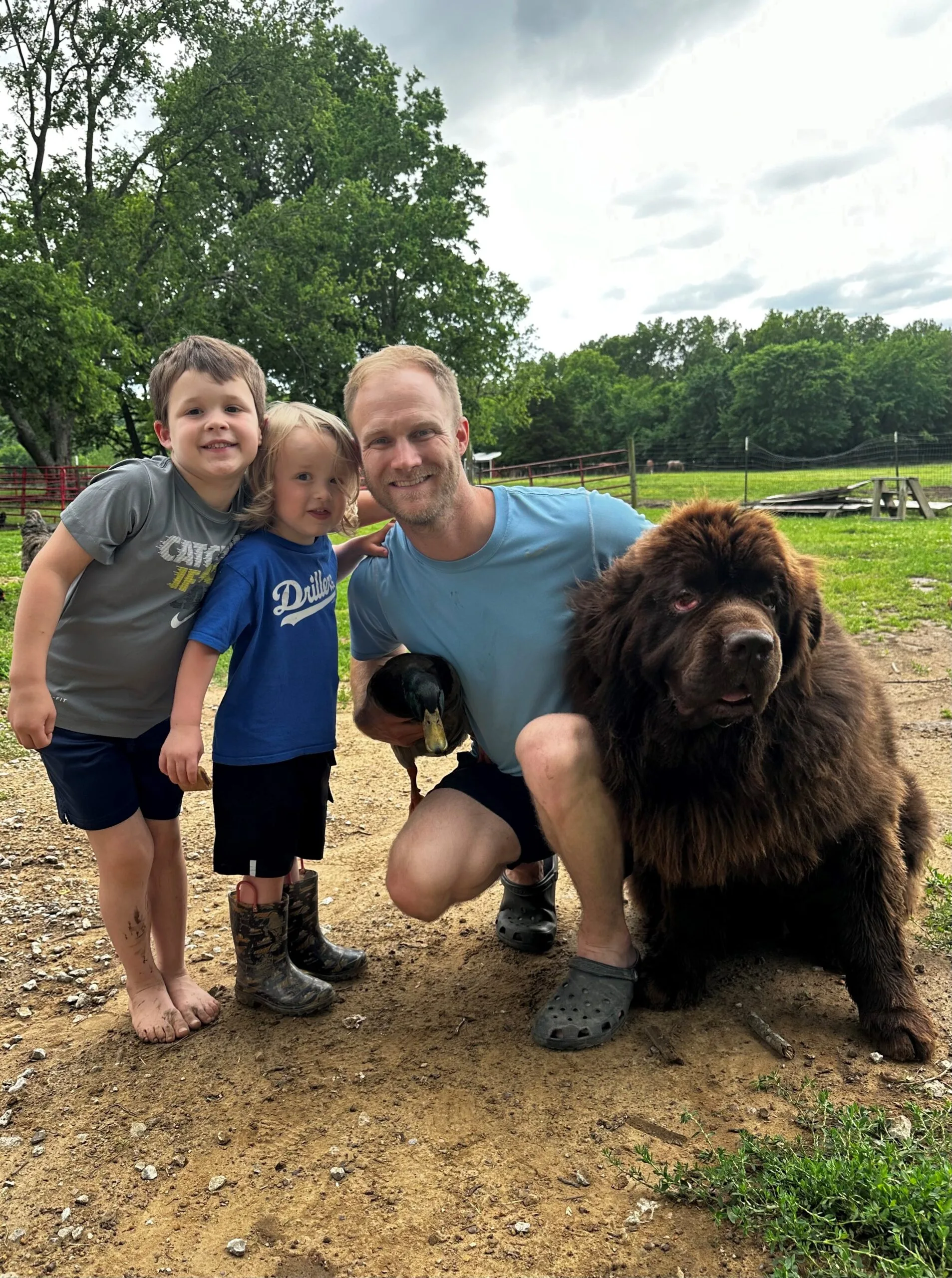 Image of duck, dog, dad and two kids