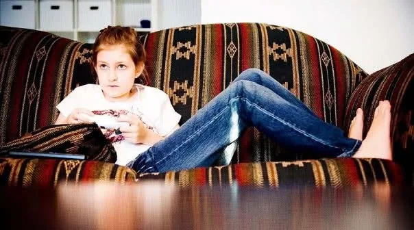 Little girl playing video games