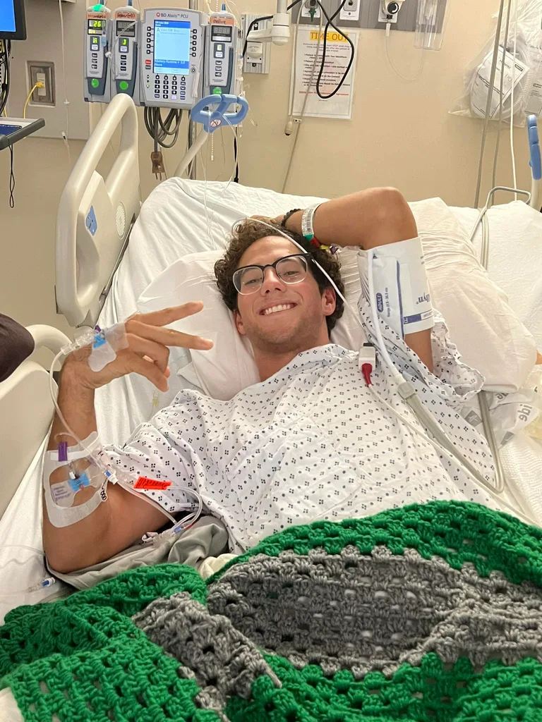 Image of guy recovering in hospital