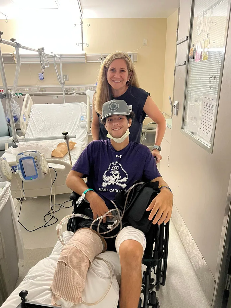 Image of mum and son post amputation surgery