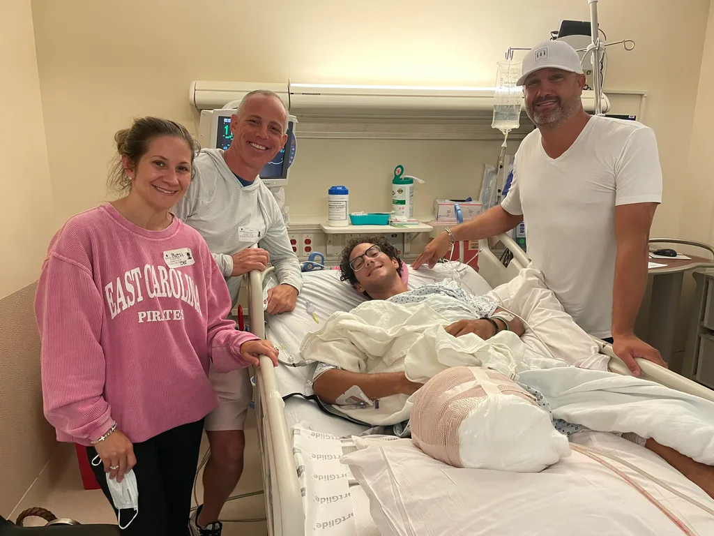 Image of people visiting boy in hospital