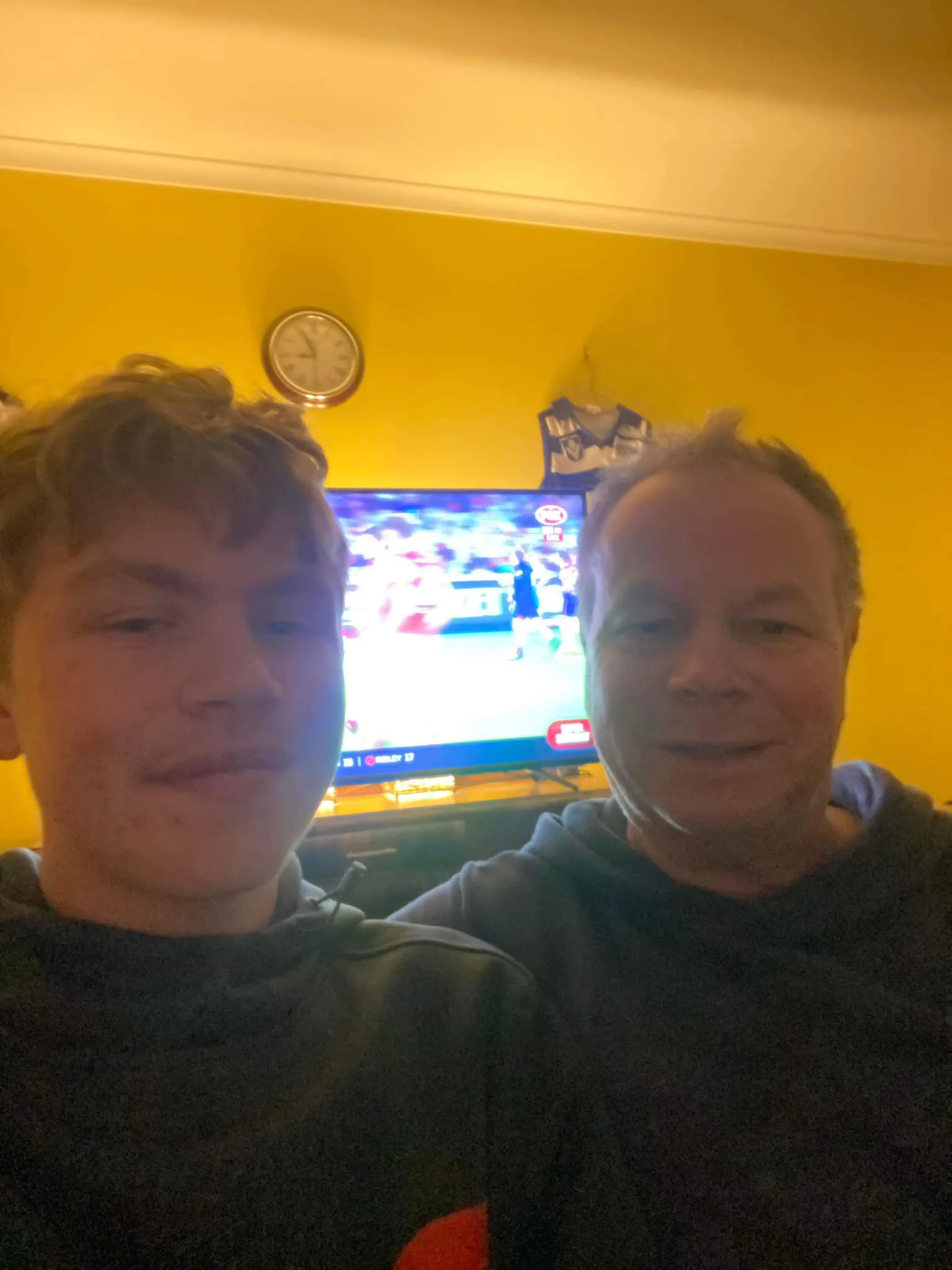 Noah and his grandfather Geoff smiling for the camera