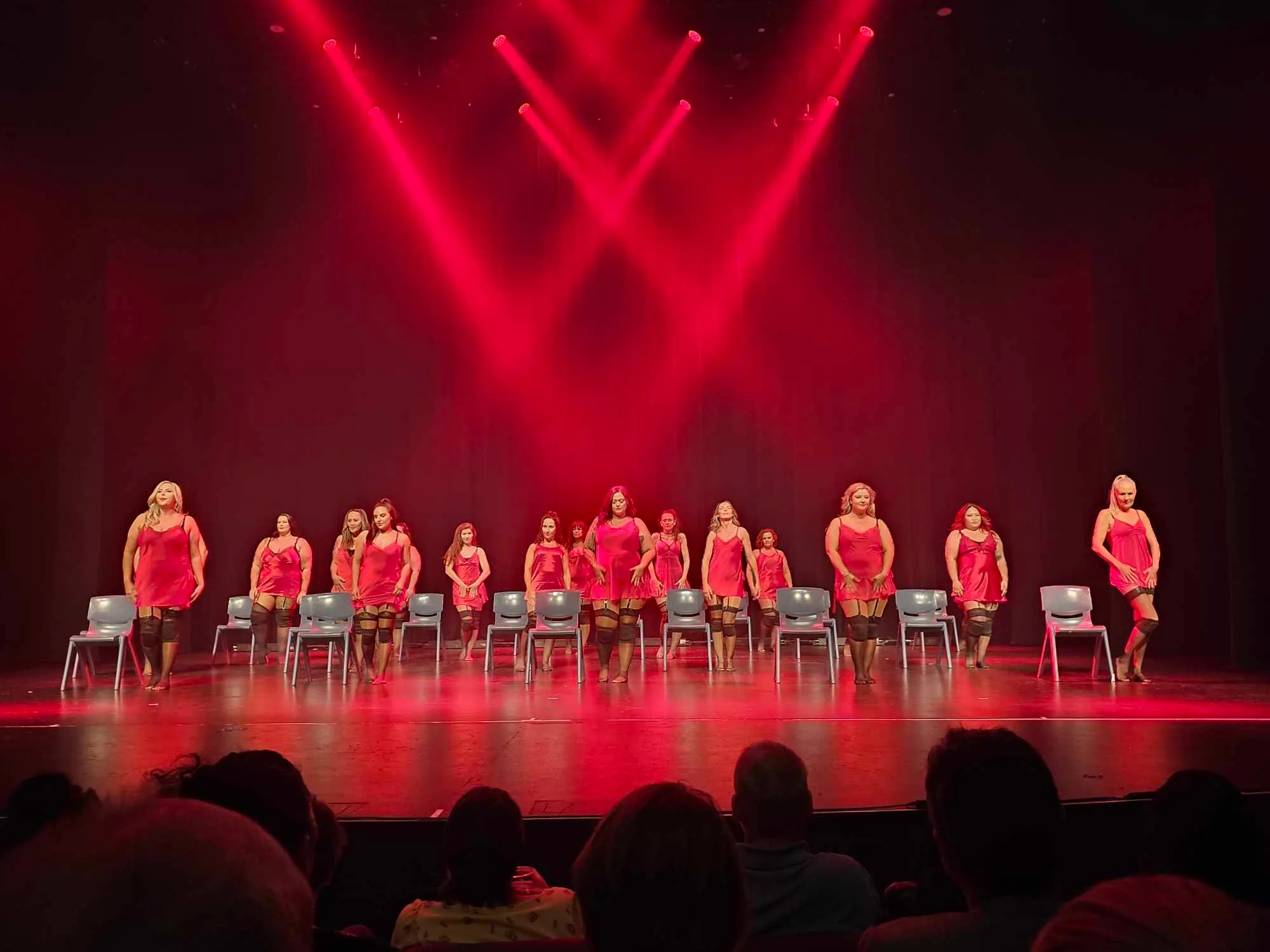 Image of women on stage dancing burlesque