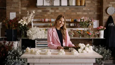 Woman behind counter of florists