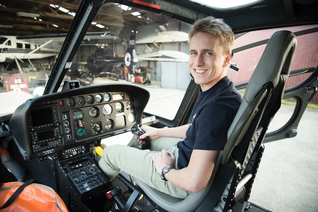 Image of man sitting in the cockpit of a helicopter