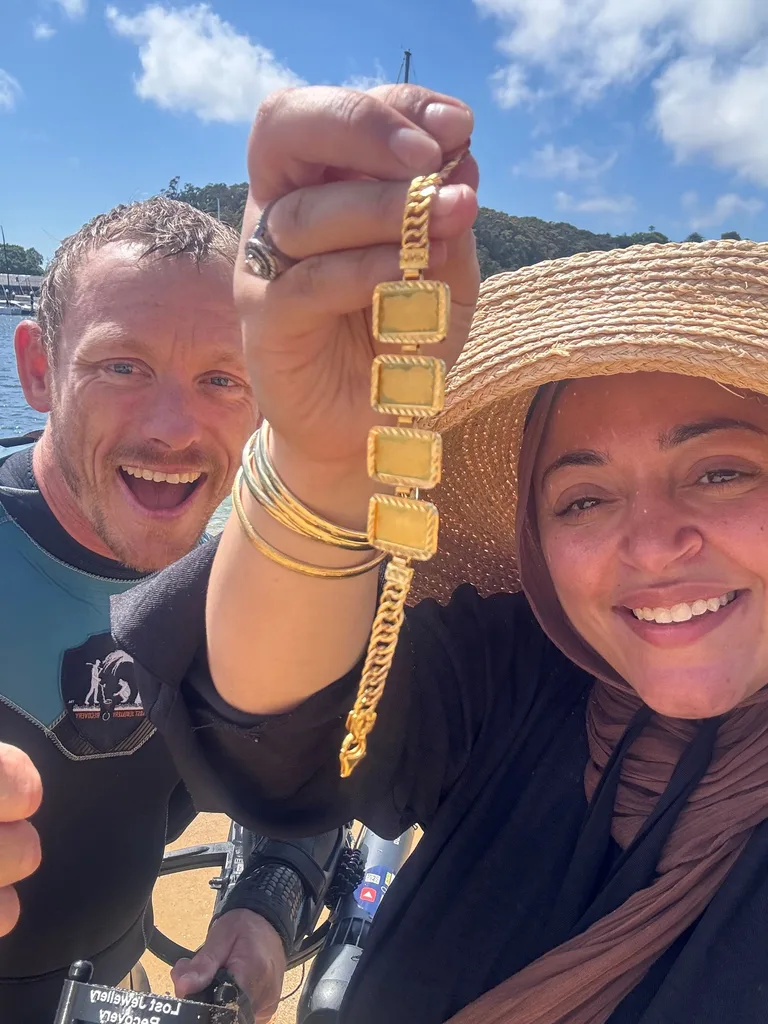 Michael and a happy client after Michael found the lost jewellery