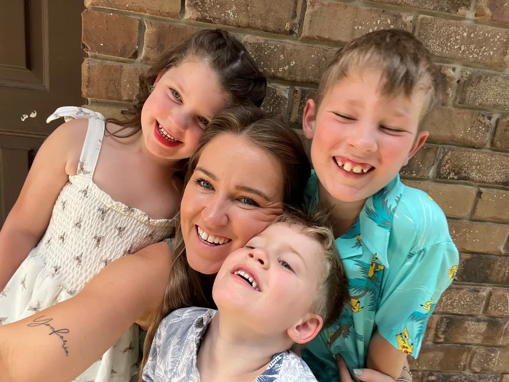 Image of mum and three children diagnosed with childhood dementia