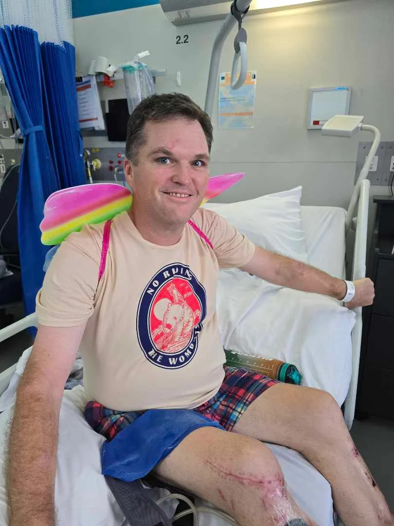 Quinten in hospital wearing the wings that his friend gifted him as his 'wings were clipped'