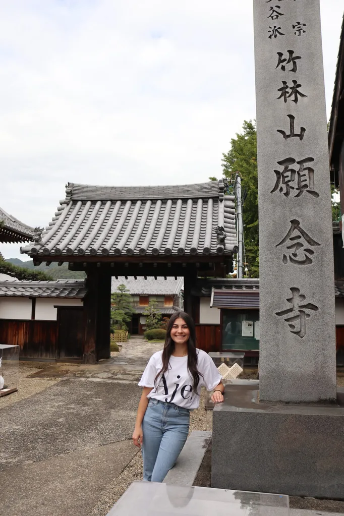 Image of woman standing at a Japanese temple