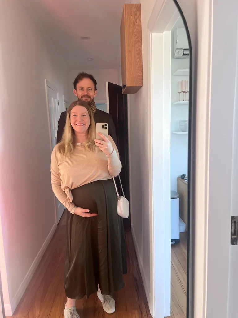 Samantha pregnant, Toby standing behind her