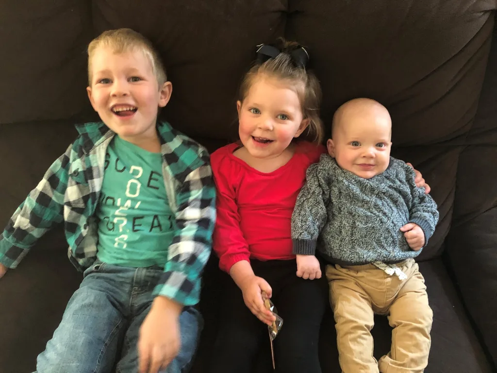 Image of two sons and daughter diagnosed with childhood dementia