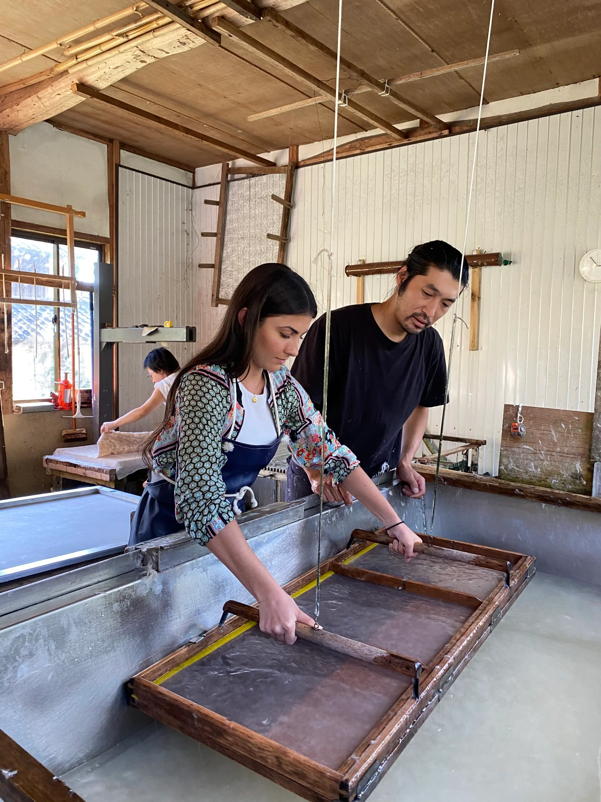 Image of woman learning to make traditional japanese washi paper