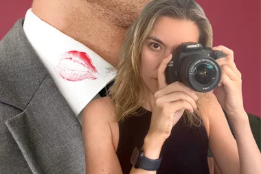 Australian private investigator Cassie Crofts holding a camera to her face.