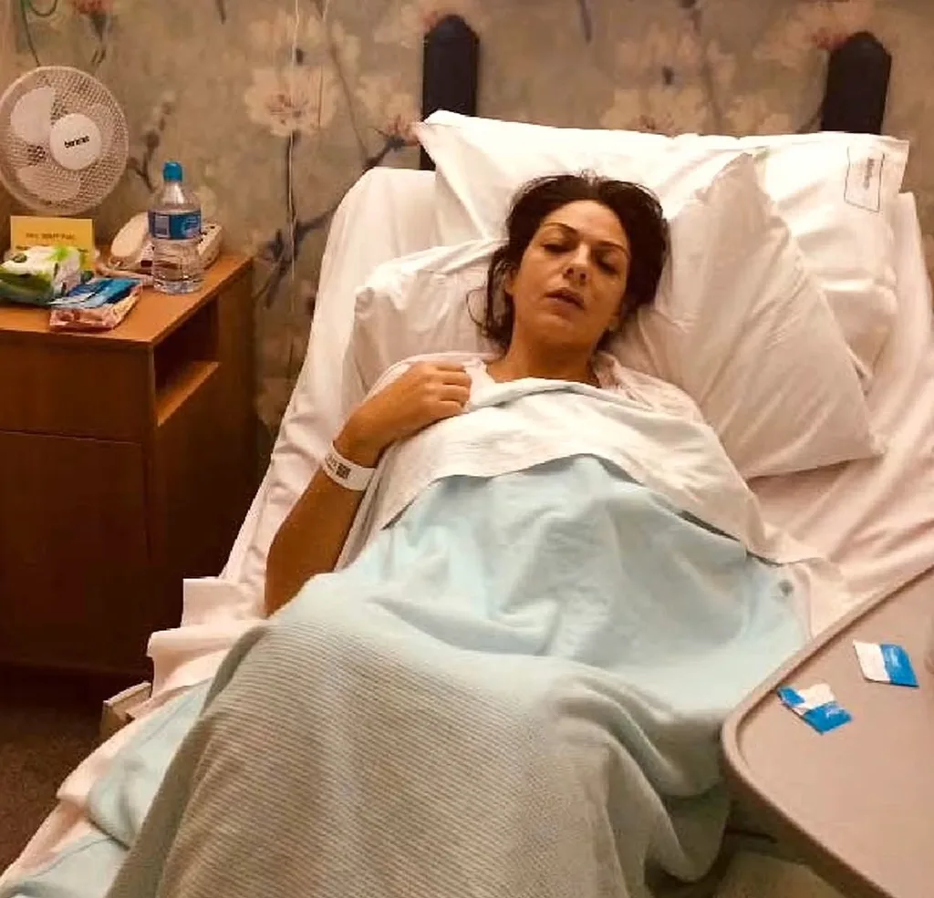 Image of woman laying in hospital bed