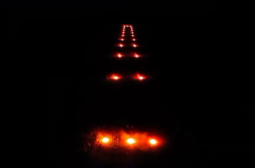 Black Runway with fire on it lit by toilet rolls