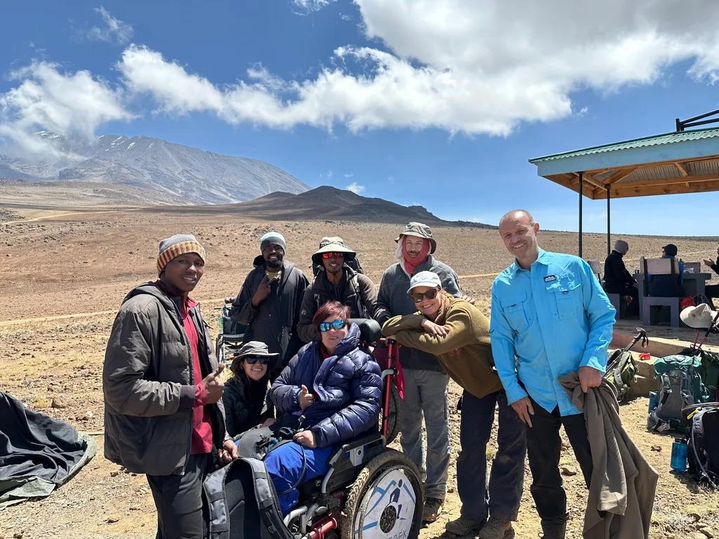 Image of group of people summiting mount kilimanjaro
