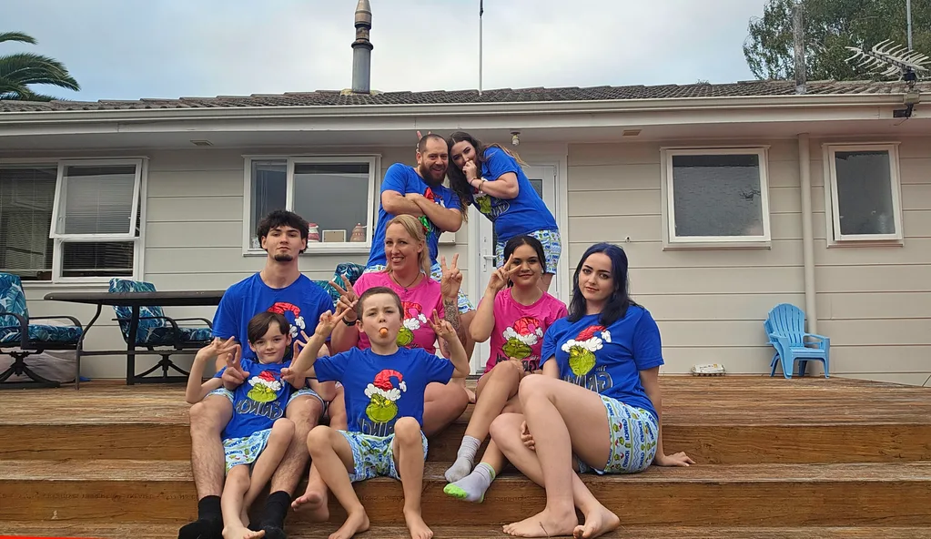 Image of family wearing matching Christmas tops