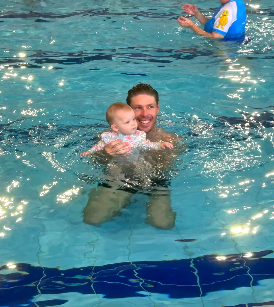 Image of father and daughter swimming lessons