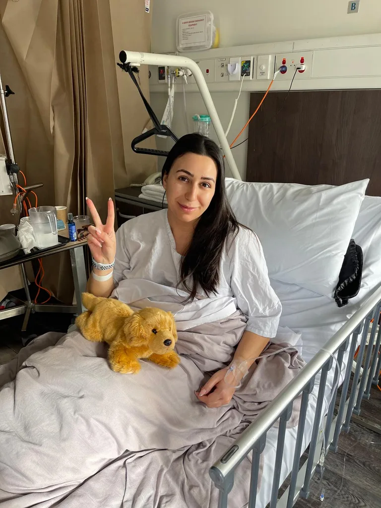 Image of woman laying in hospital bed