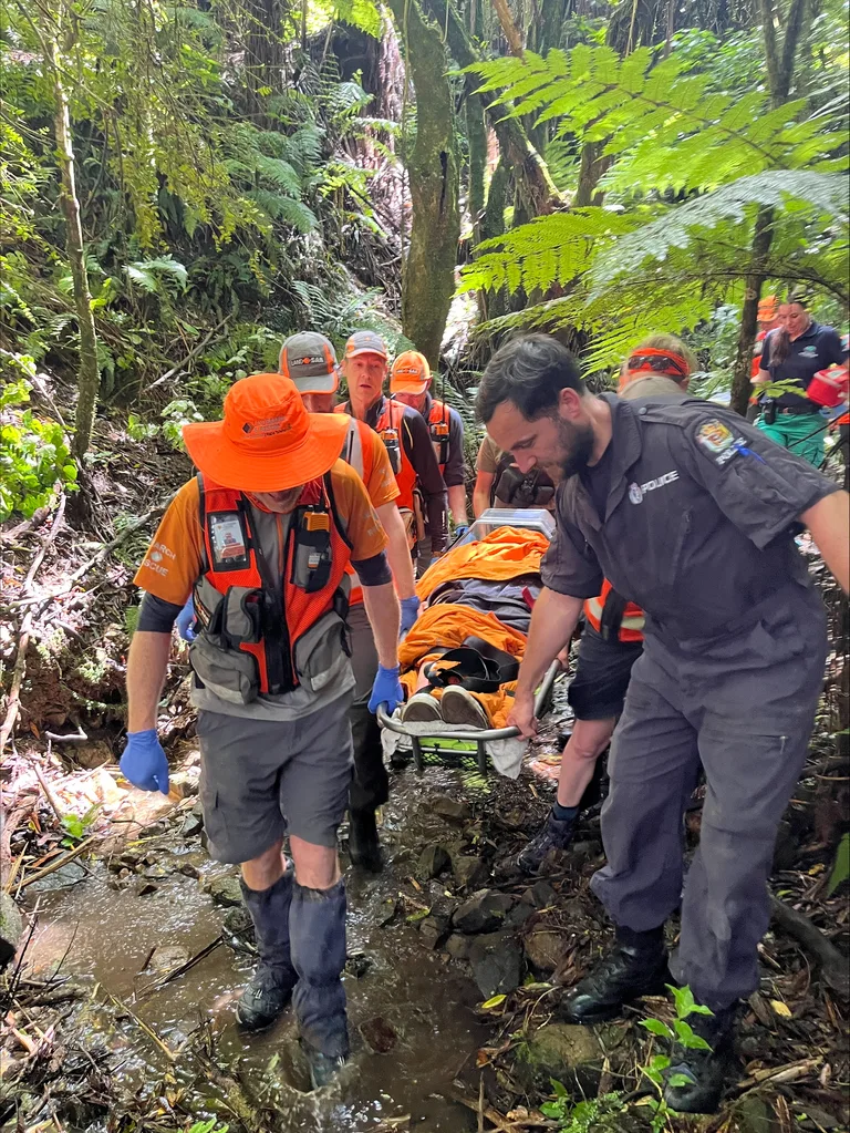 Image of rescuers rescuing girl from the bush