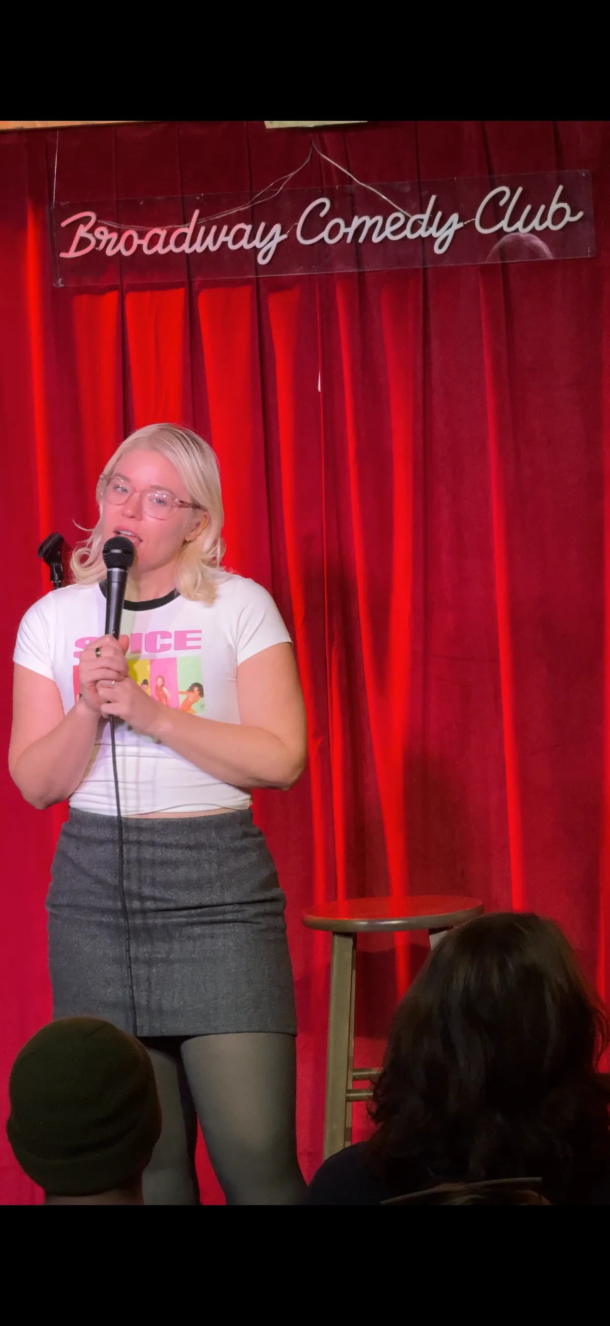 Image of woman performing stand up comedy post jetski accident
