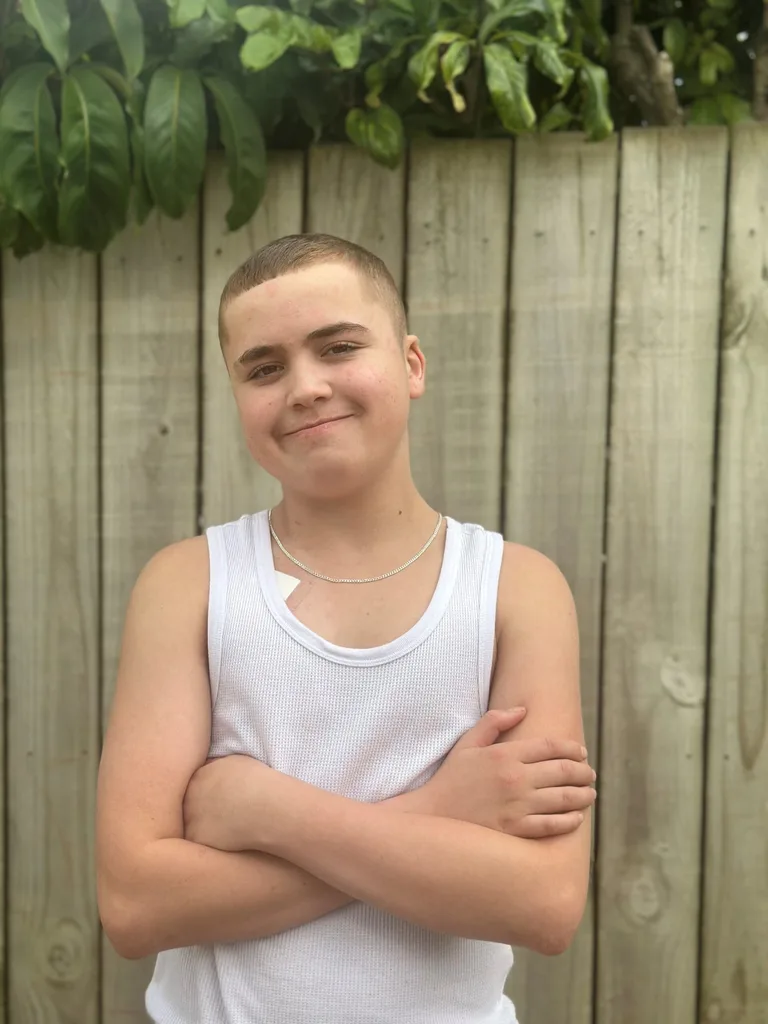 Tyson is now healthy. He is standing and smiling.