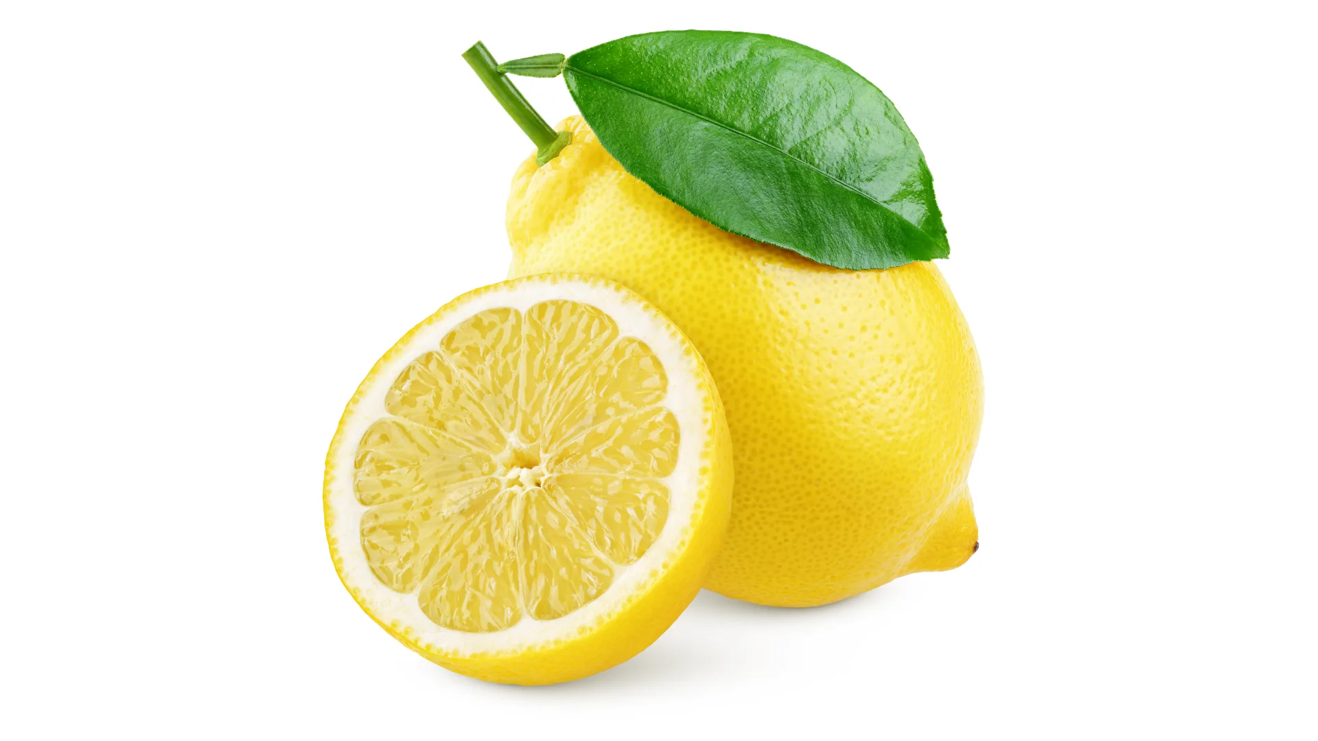 Two lemons, one whole and one sliced in half