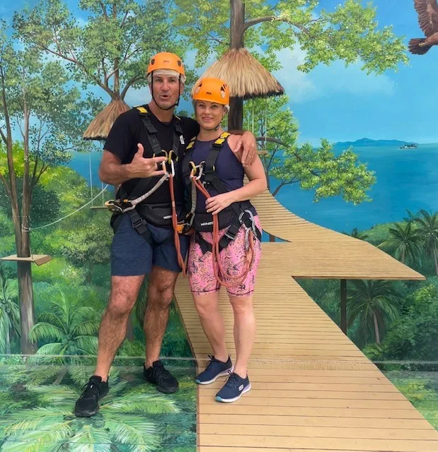 Image of man and woman rock climbing after falling in love at a funeral