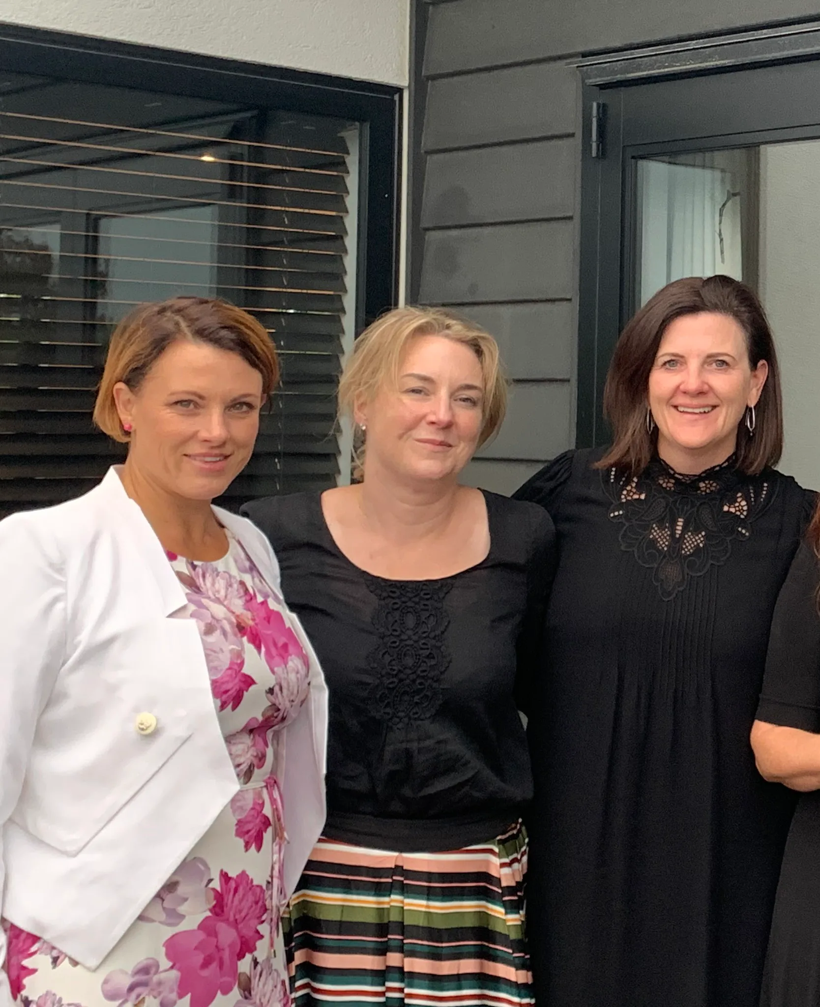 Image of three women at a funeral