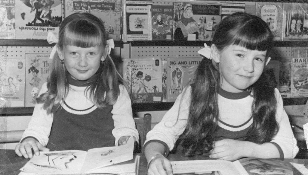 A black and white photograph of Tracey Ann Patient and her sister Debbie as young girls