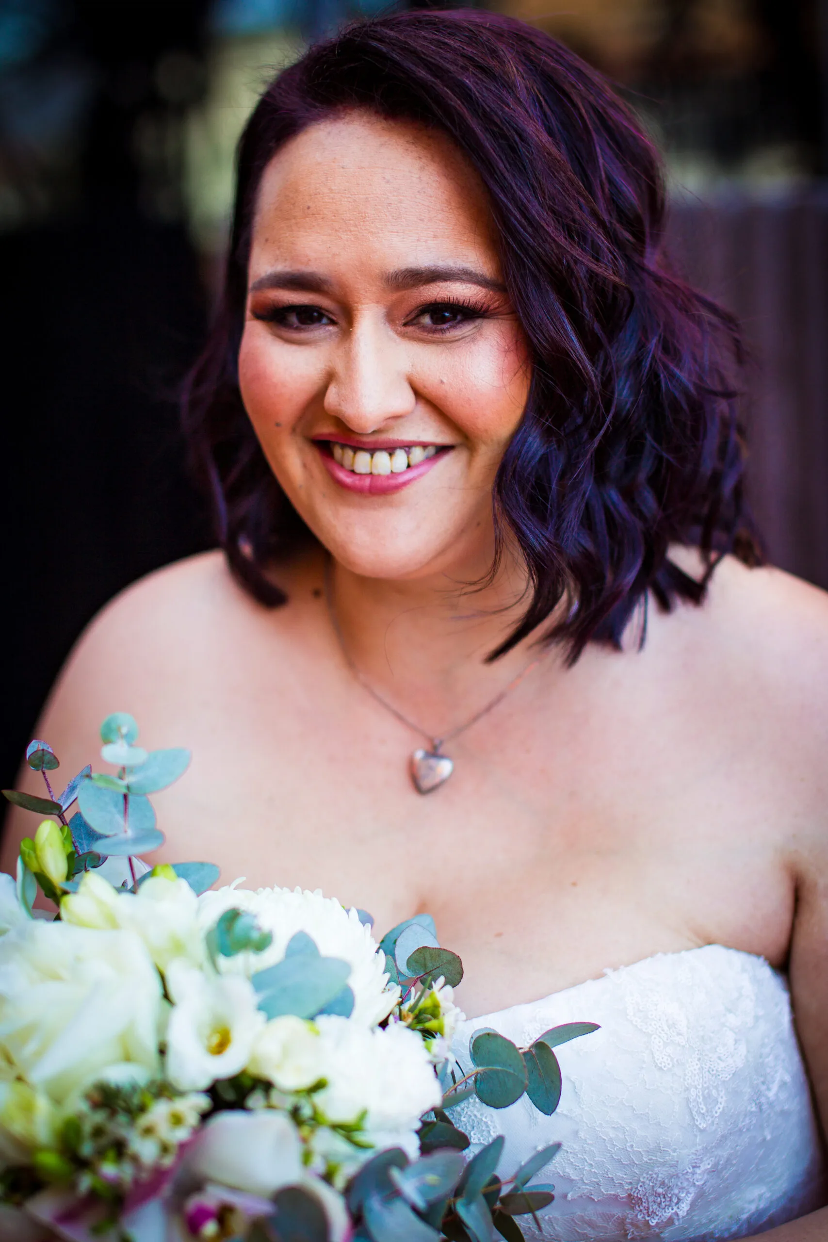 Ebony wearing her bridal makeup and wearing her wedding dress. 