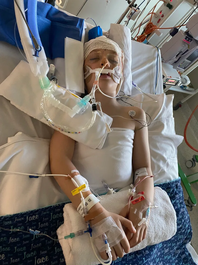 Image of young boy in hospital on breathing tube