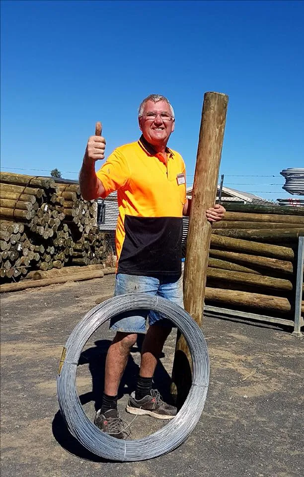 man fixing fences