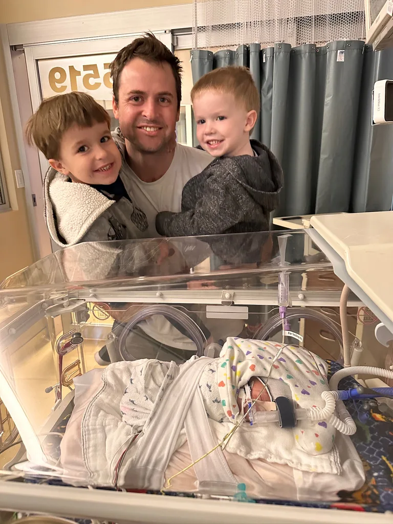 Image of dad three sons in the hospital