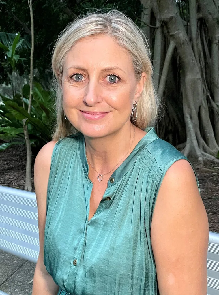 Image of woman wearing blue top