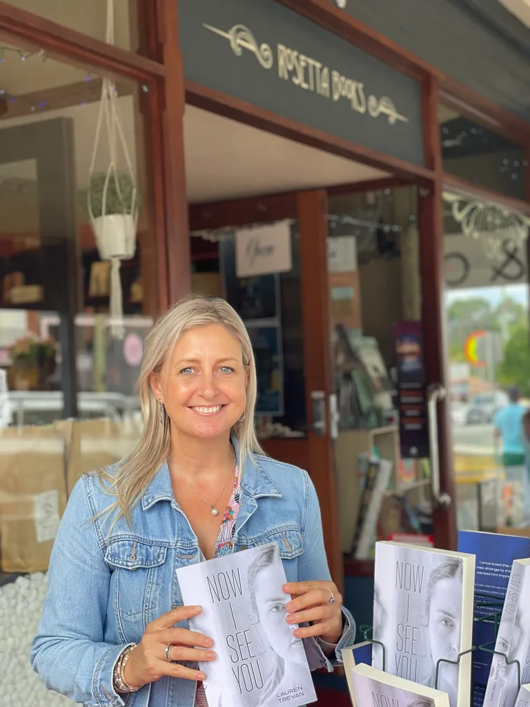 Image of woman holding her book
