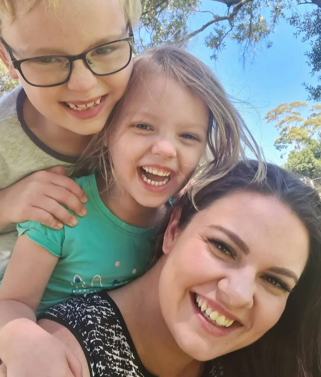 woman and kids cuddling