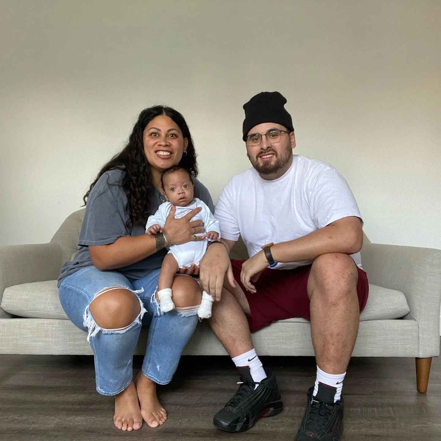 family sitting on couch