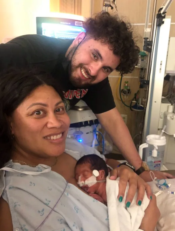 woman, man and baby in hospital