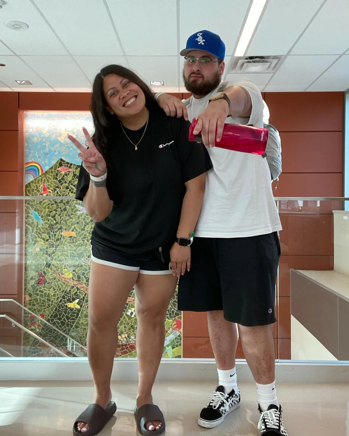 man and woman posing for photo