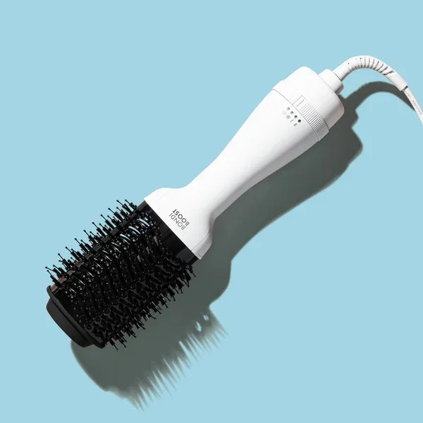 A hair tool Bondi Boost Blow Out Brush against a light blue background