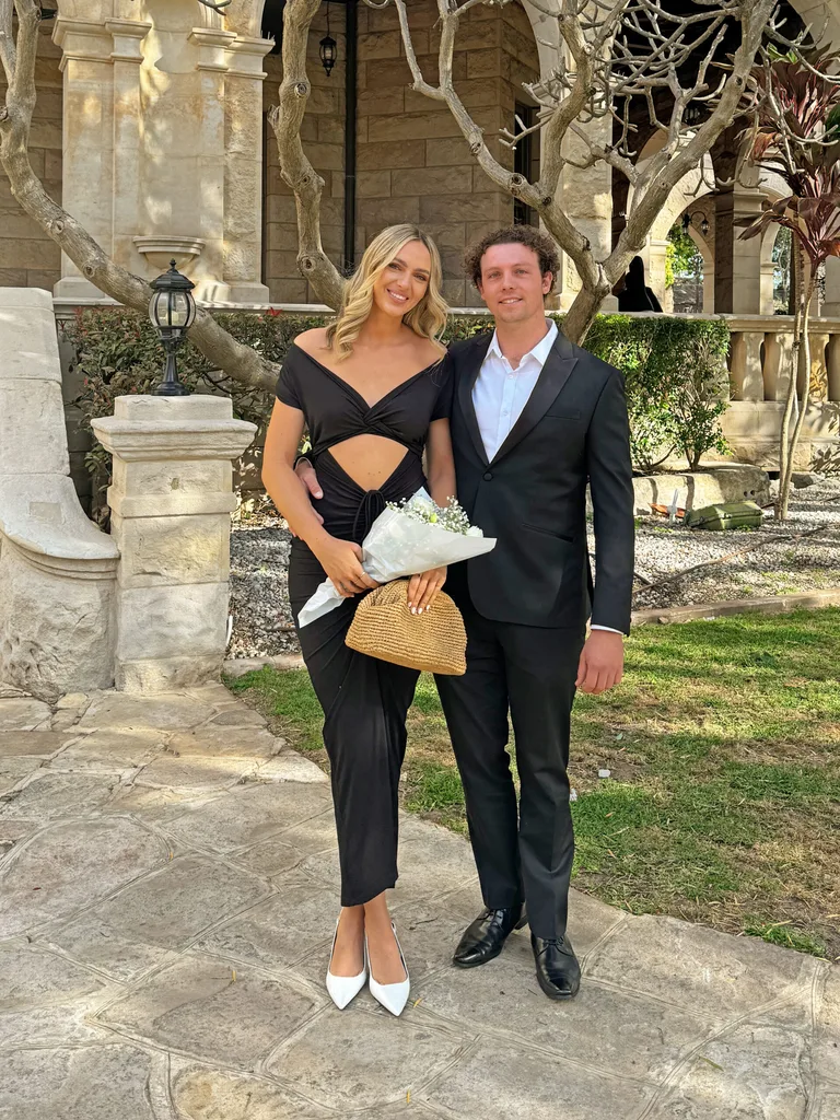 Image of man and woman wearing black tie