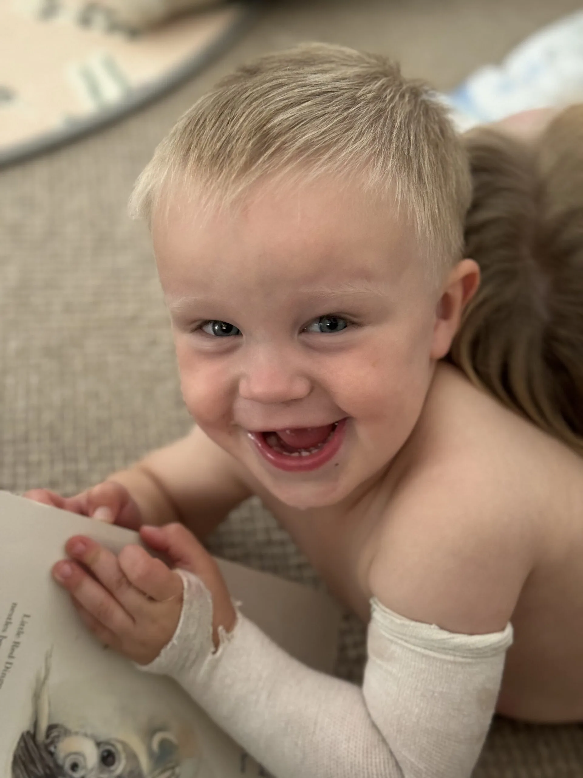 little boy with white bandage on arm