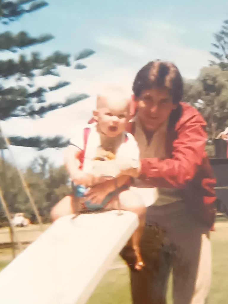An old picture from the 80s of Jeffrey Thomas Brant with Kylie Brant's brother, Matthew. They are outside with Matthew on a see-saw
