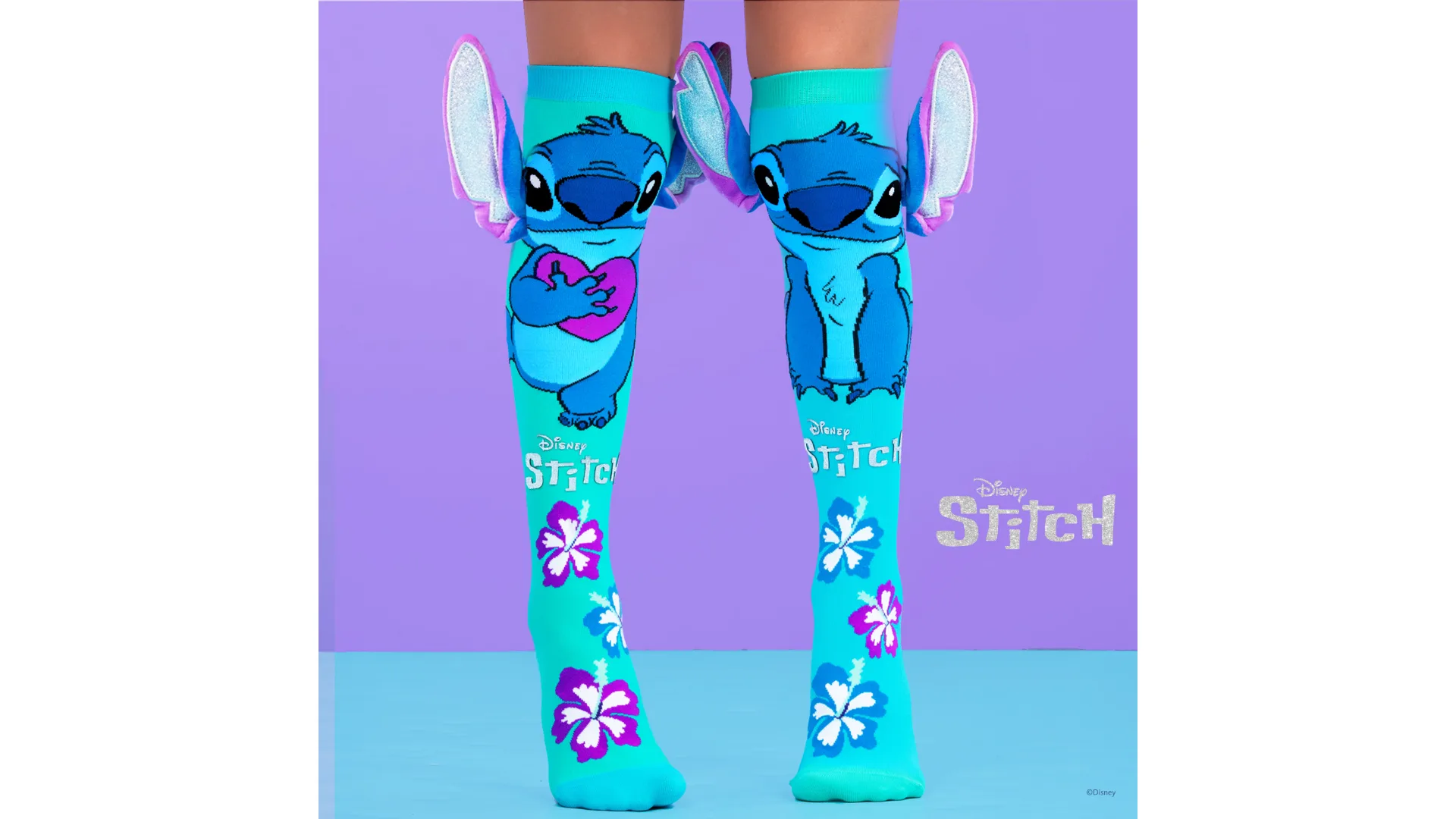 MADMIA's vibrant Stitch socks are shown on a model's legs.